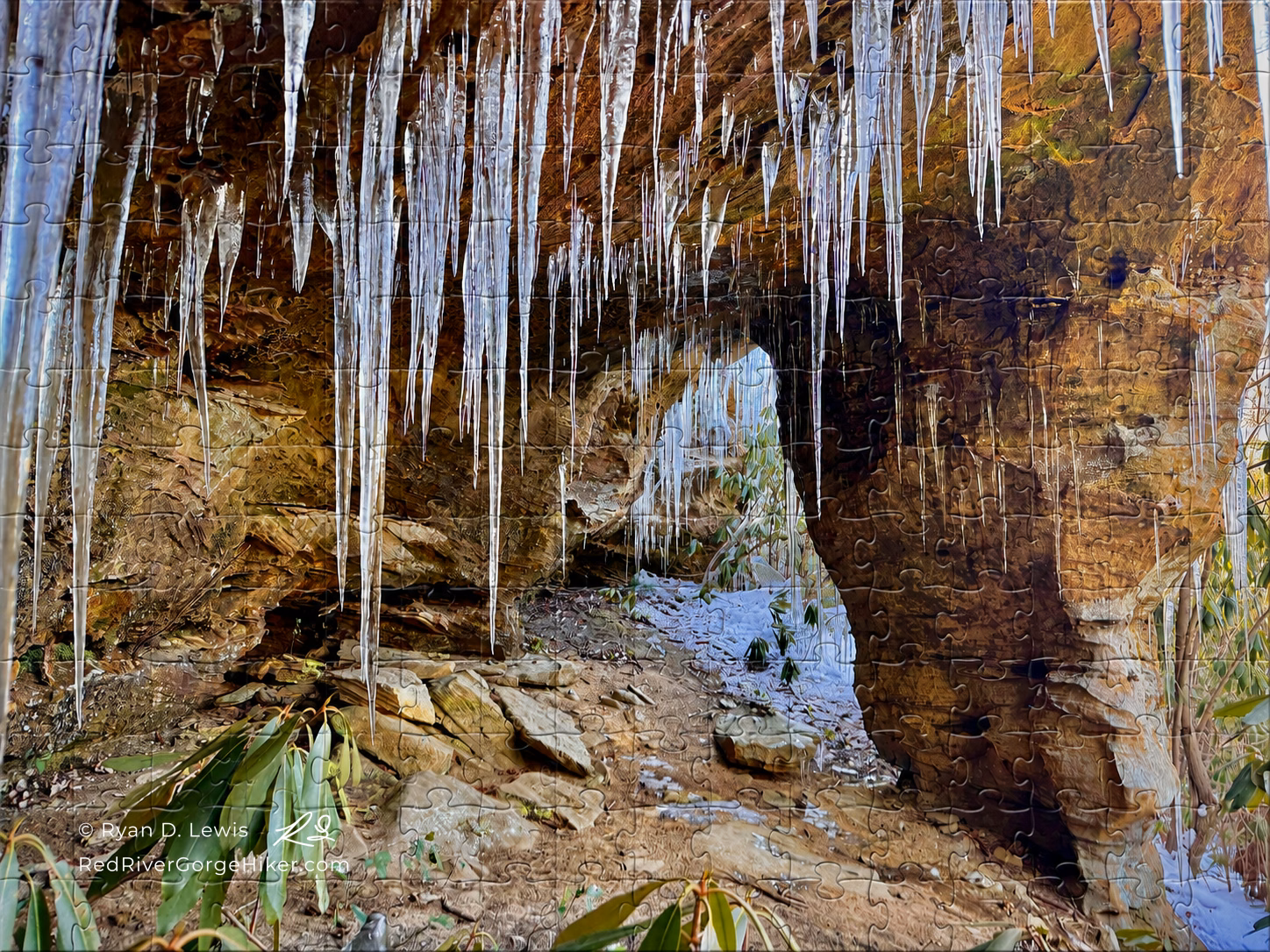500-piece jigsaw puzzle showing Ice at West of Copperas Pillar with long icicles and the Red River Gorge Hiker artist mark.